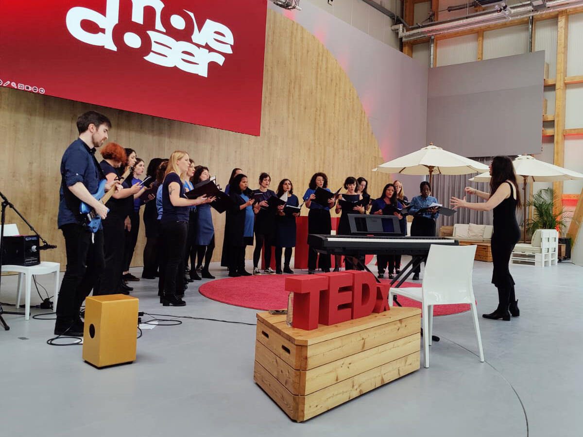 Choir singing at TEDx Mitte Part of the choir performing at TEDx Mitte in October 2024